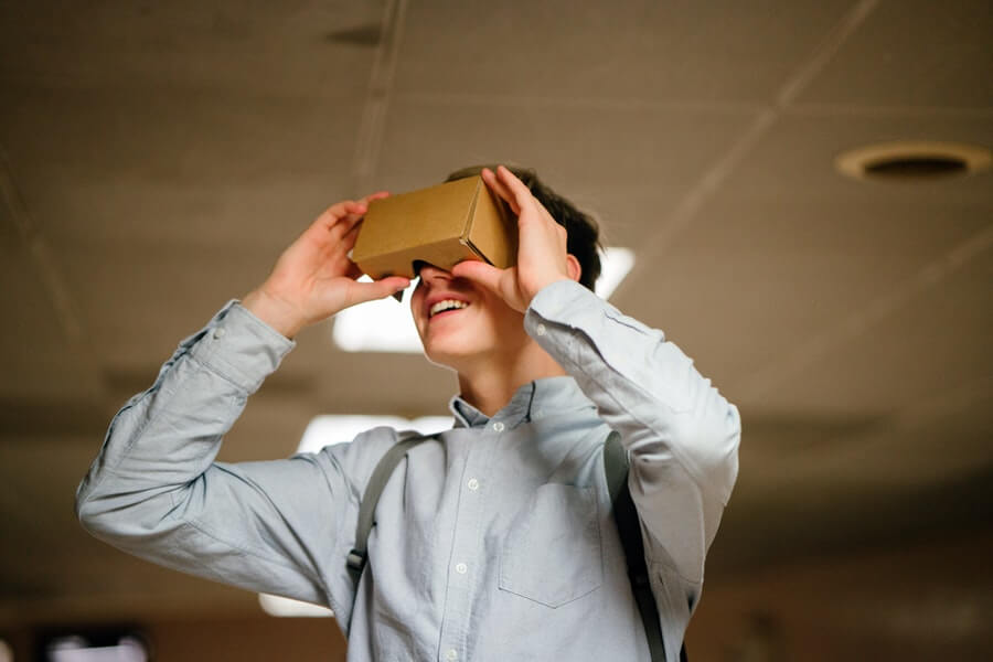 Here we see a hipster-to-be before he was cool, looking through some cardboard Google Googles before they were invented.