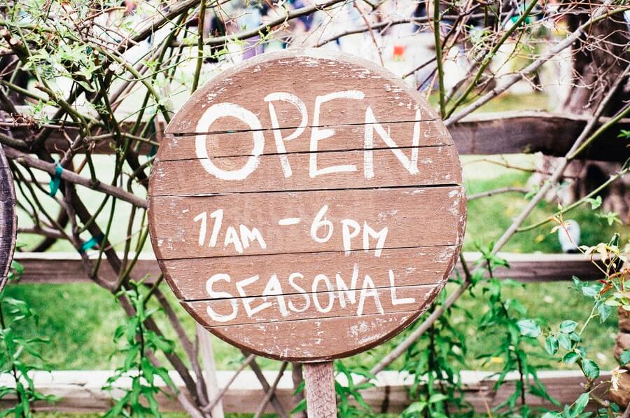 Hand-painted seasonal open sign. Farmer's market? Hipsters? You be the judge.