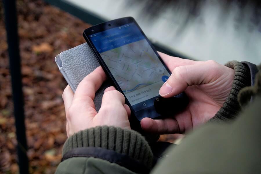 Man looking at google maps on his Android smartphone.