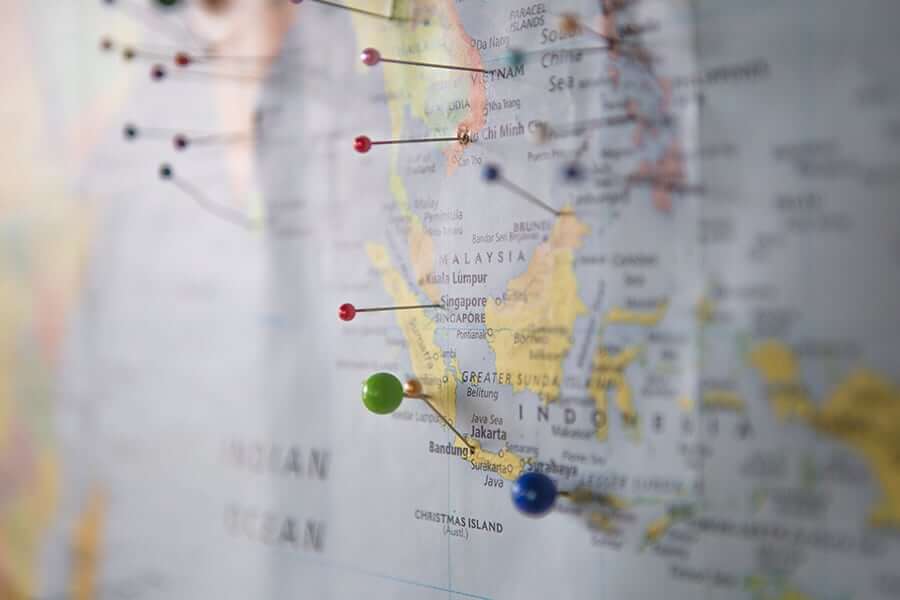 Map of Southeast Asia with pins in it.